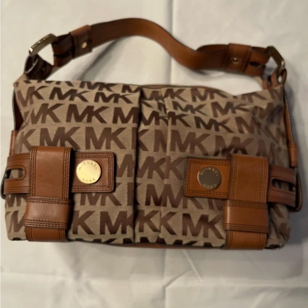 Michael Kors tan with brown leather trim.